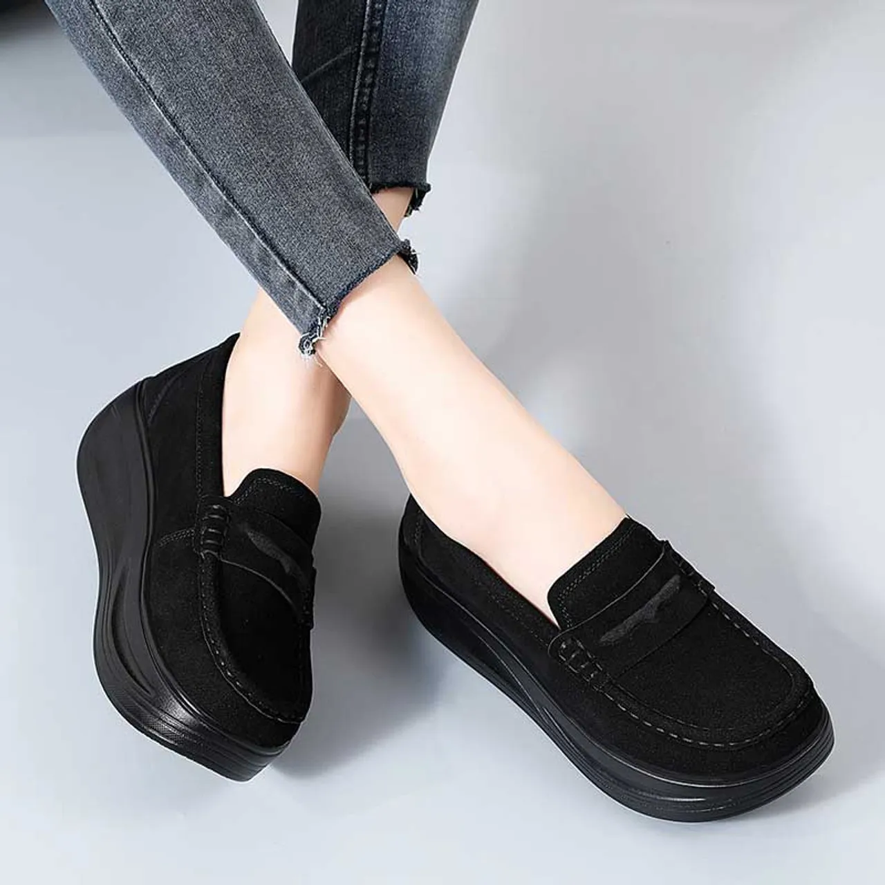 Black suede penny slip on rocker bottom sneaker