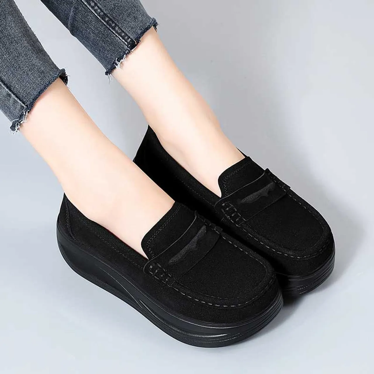 Black suede penny slip on rocker bottom sneaker