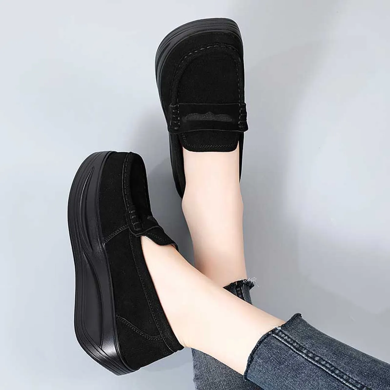 Black suede penny slip on rocker bottom sneaker