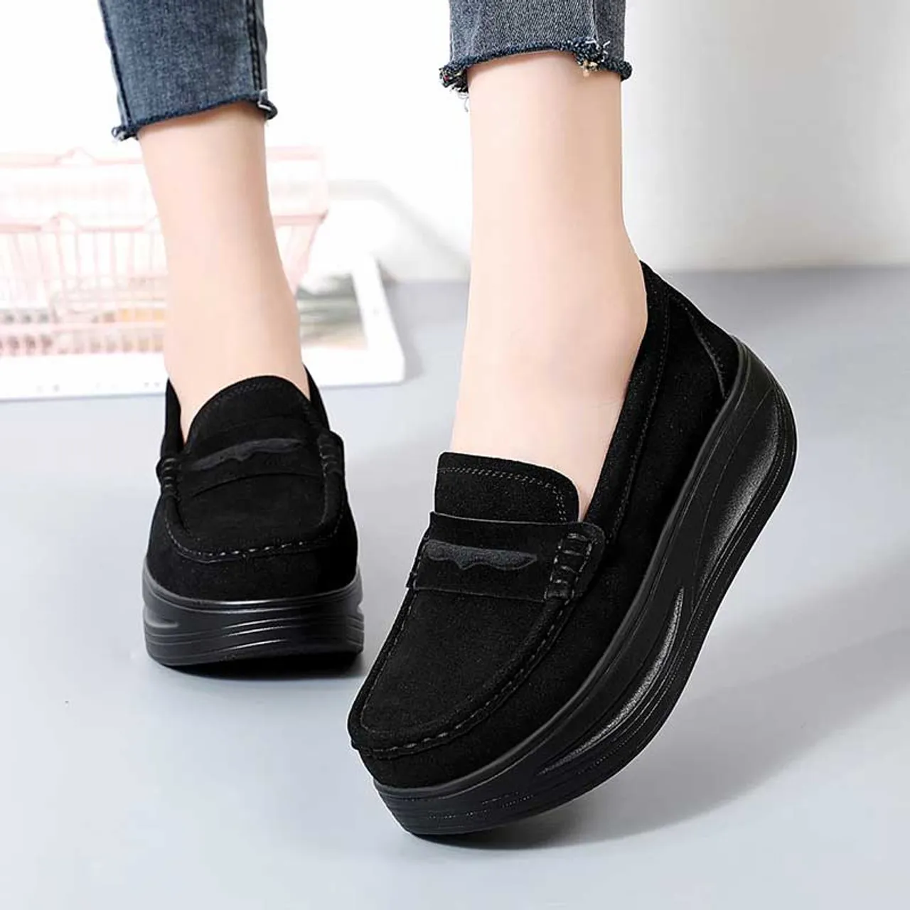 Black suede penny slip on rocker bottom sneaker