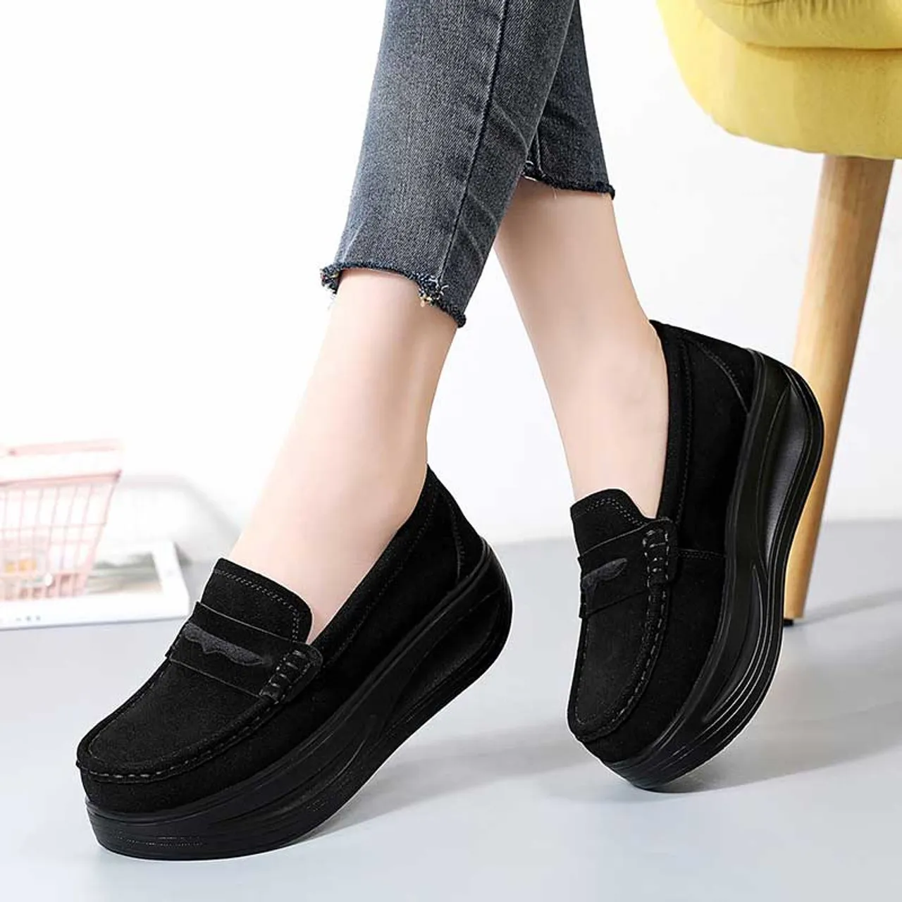 Black suede penny slip on rocker bottom sneaker